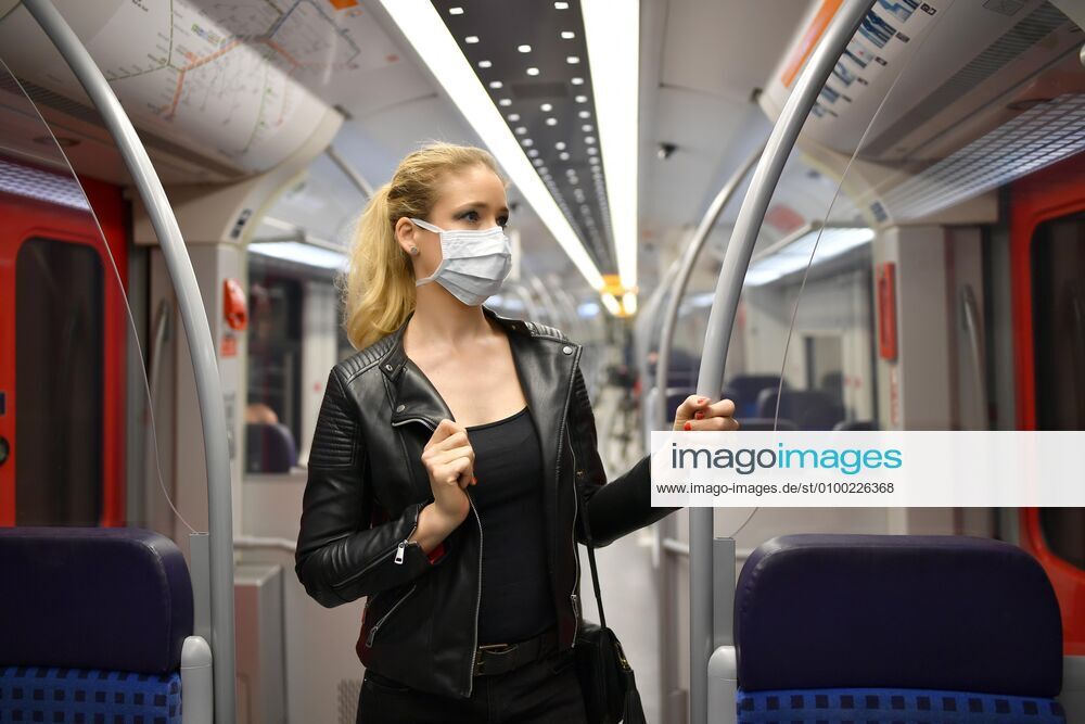 Woman with face mask, standing in S Bahn, Corona crisis, Stuttgart, Baden Württemberg, Germany, Europe