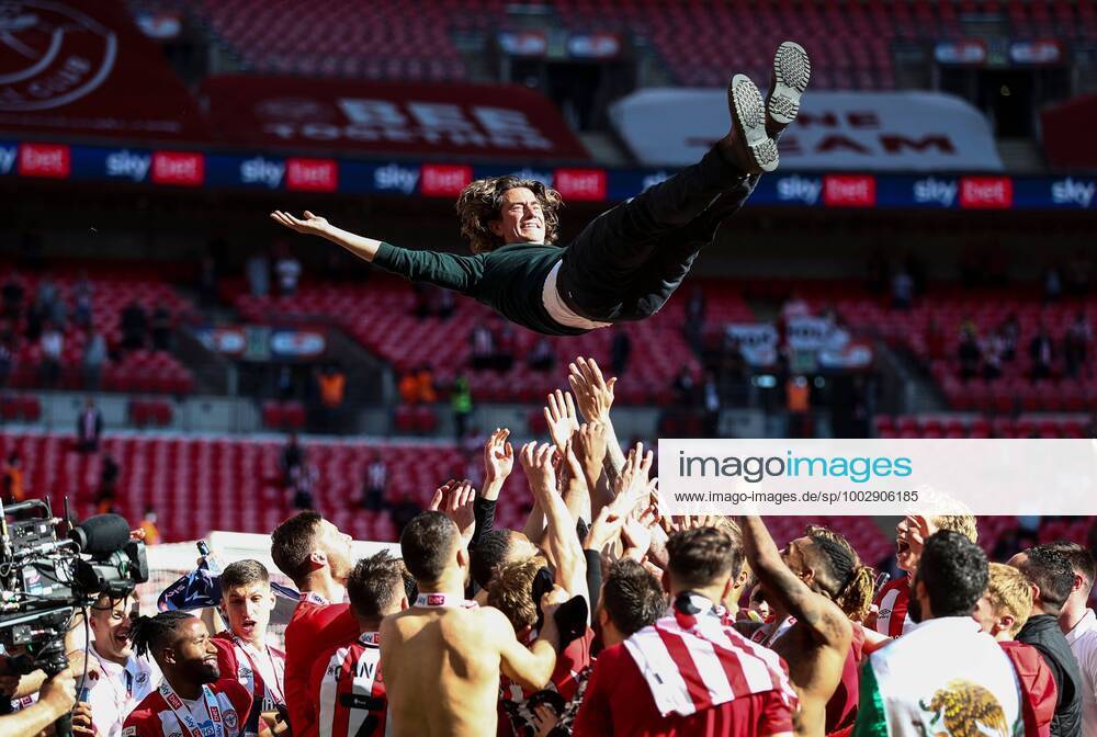 KW21 Mandatory Credit: Photo by James Marsh BPI Shutterstock (11976058et) Thomas Frank manager of Brentford is thrown in the air by his players in celebration Brentford v Swansea City, EFL Sky Bet Championship, Playoffs, Final, Football, Wembley Stadium, London, UK - 29 May 2021 Brentford v Swansea City, EFL Sky Bet Championship, Playoffs, Final, Football, Wembley Stadium, London, UK