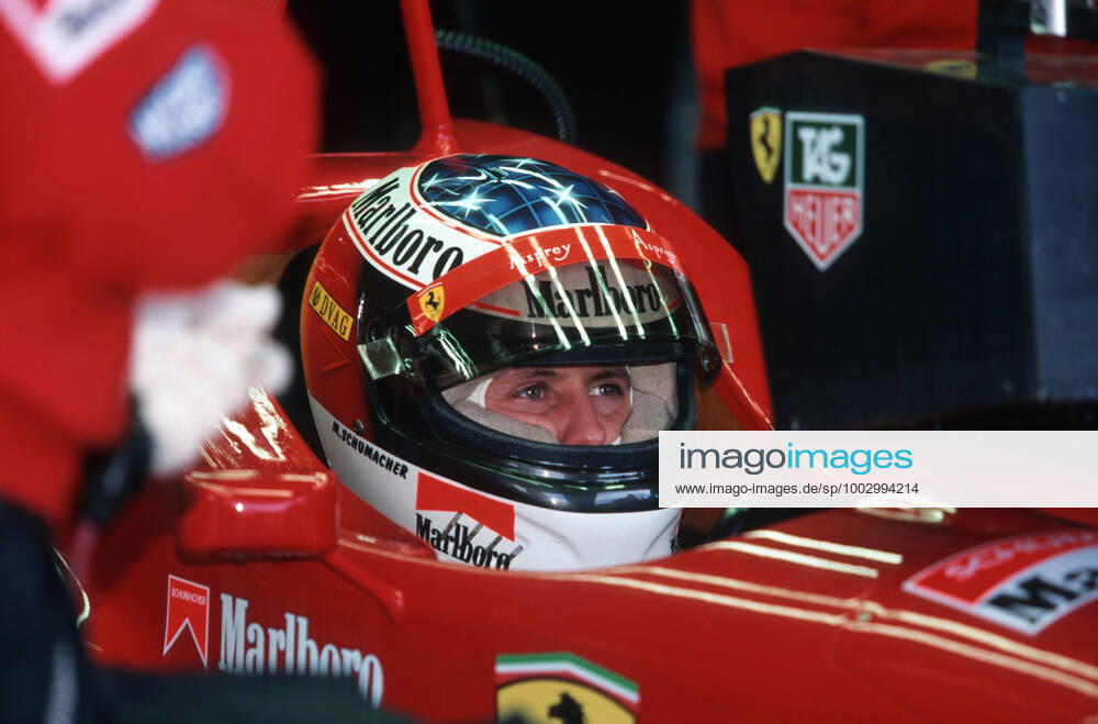Michael Schuhmacher left in the pit lane at the Formula 1 in Melbourne in Australia Ralf Schuhmacher left with brother Michael Schuhmacher right in the pit lane at the Formula 1 in Melbourne in Australia