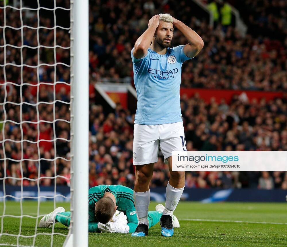 Mandatory Credit: Photo by Magi Haroun Shutterstock (10213171m) Manchester United, ManU goalkeeper David de Gea saves whilst Sergio Aguero of Manchester City reacts Manchester United v Manchester City, Premier League, Football, Old Trafford, Manchester, UK - 24 Apr 2019 No use with unauthorised audio, video, data, fixture lists (outside the EU), club league logos or live services. Online in-match use limited to 45 images (+15 in extra time). No use to emulate moving images. No use in betting, games or single club league player publications services. Manchester United v Manchester City, Premier League, Football, Old Trafford, Manchester, UK - 24 Apr 2019 No use with unauthorised audio, video, data, fixture lists (outside the EU), club league logos or live services. Online in-match use limited to 45 images (+15 in extra time). No use to emulate moving images. No use in betting, games or