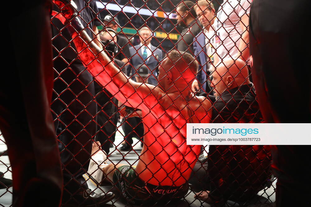 UFC 264, T-Mobile Arena, Las Vegas, Nevada, USA 10 7 2021 Dustin Poirier vs Conor McGregor Conor McGregor is helped to his feet and put on a stretcher after injuring his ankle Conor McGregor is helped to his feet and put on a stretcher after injuring his ankle 10 7 2021