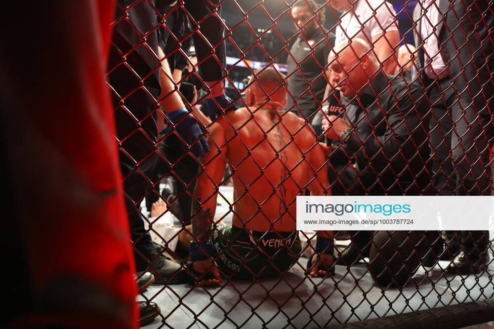 UFC 264, T-Mobile Arena, Las Vegas, Nevada, USA 10 7 2021 Dustin Poirier vs Conor McGregor Conor McGregor is helped to his feet and put on a stretcher after injuring his ankle Conor McGregor is helped to his feet and put on a stretcher after injuring his ankle 10 7 2021