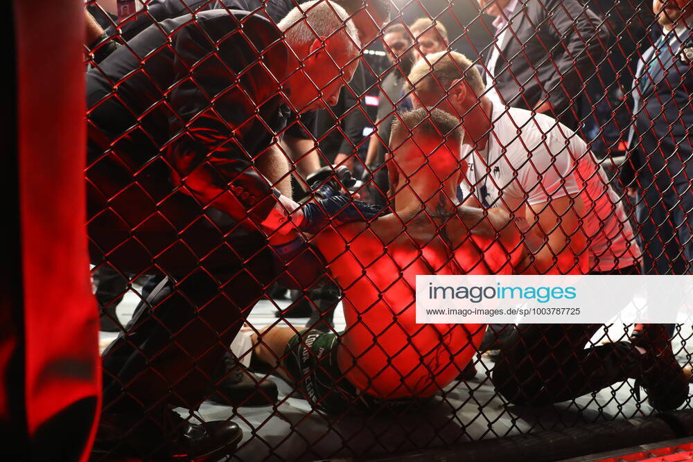 UFC 264, T-Mobile Arena, Las Vegas, Nevada, USA 10 7 2021 Dustin Poirier vs Conor McGregor Conor McGregor is helped to his feet and put on a stretcher after injuring his ankle Conor McGregor is helped to his feet and put on a stretcher after injuring his ankle 10 7 2021
