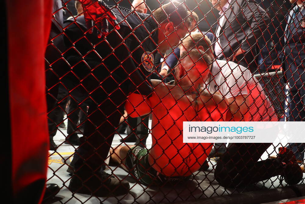 UFC 264, T-Mobile Arena, Las Vegas, Nevada, USA 10 7 2021 Dustin Poirier vs Conor McGregor Conor McGregor is helped to his feet and put on a stretcher after injuring his ankle Conor McGregor is helped to his feet and put on a stretcher after injuring his ankle 10 7 2021