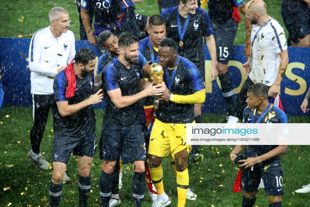 Mandatory Credit: Photo by Michael Zemanek BPI Shutterstock (9762118jc) Olivier Giroud of France and Goalkeeper Steve Mandanda of France with the trophy France v Croatia, Final, 2018 FIFA World Cup, WM, Weltmeisterschaft, Fussball football match, Luzhniki Stadium, Moscow, Russia - 15 Jul 2018 France v Croatia, Final, 2018 FIFA World Cup football match, Luzhniki Stadium, Moscow, Russia - 15 Jul 2018