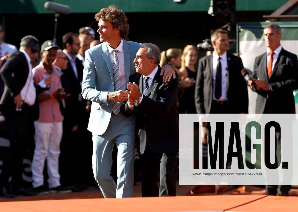 Mandatory Credit: Photo by Ella Ling Bpi Shutterstock (4826641ay) Gustavo Kuerten of Brazil hugs Jean Gachassin, President of the FFT, during the Final at Roland Garros, 2015 French Open Tennis Tournament, Roland Garros, Paris, France - 07 Jun 2015 Editorial use only. No merchandising. French Open Tennis Tournament, Roland Garros, Paris, France - 07 Jun 2015 Editorial use only. No merchandising.