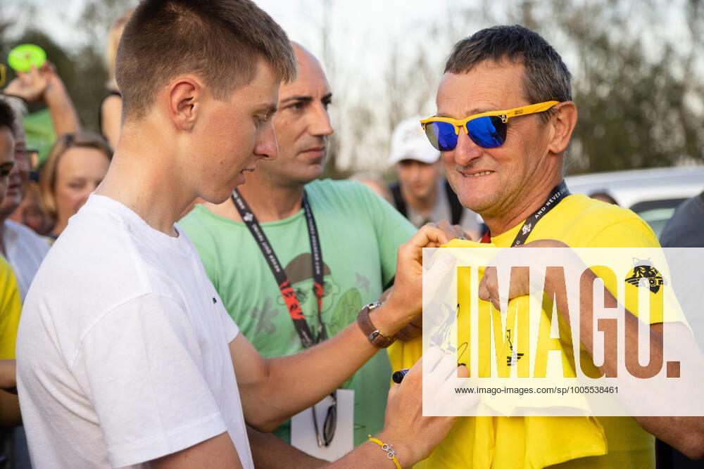 Two-time Tour de France winner Tadej Pogacar signs an autograph for his father at a reception in his honour in Komenda, his hometown. .Pogacar won the Tour de France for the second time in a row and bronze medal at the Tokyo Olympic Games, Olympische Spiele, Olympia, OS Komenda Slovenia - ZUMAs197 0129347716st
