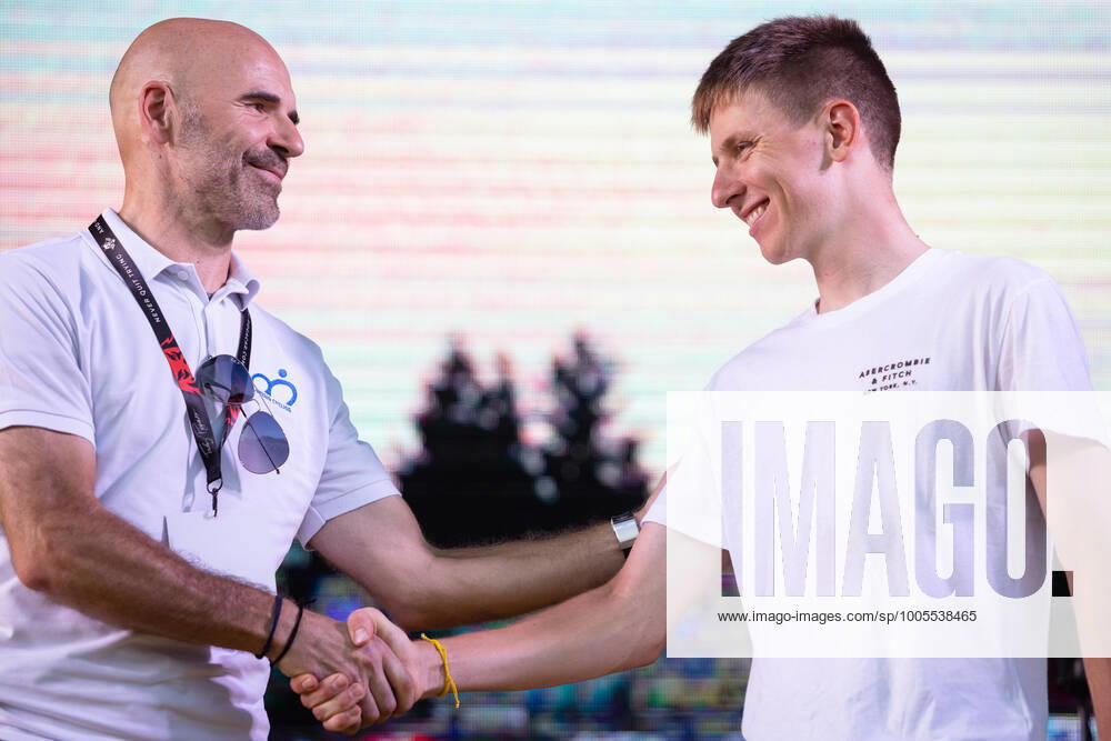 Two-time Tour de France winner Tadej Pogacar shakes hands with Pavel Mardonovic, head of the Slovenian Cycling Federation, on stage at a reception in his honour in Komenda, his hometown. .Pogacar won the Tour de France for the second time in a row and bronze medal at the Tokyo Olympic Games, Olympische Spiele, Olympia, OS Komenda Slovenia - ZUMAs197 0129347851st