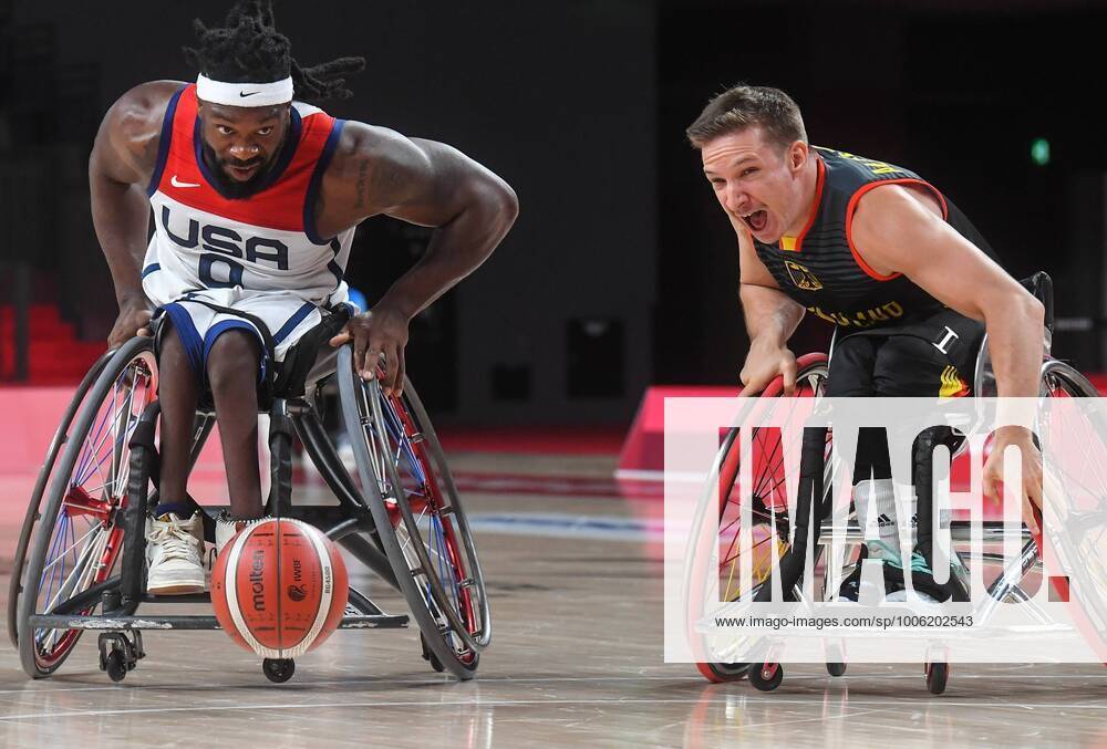 KW34 6633149 26.08.2021 Matt Scott, of the United States, left, and Germany s Jens Eicke Albrecht struggle for the ball during the men s wheelchair basketball Group B match between the United States and Germany at the Tokyo 2020 Paralympic Games at Ariake Arena in Tokyo, Japan. Ilya Pitalev Sputnik Japan Paralympics 2020 Wheelchair Basketball Men USA - Germany 88ab79ce9d9500c3