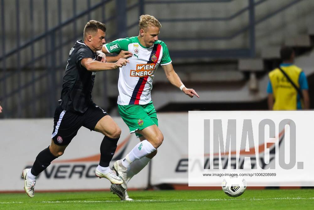 SOCCER - UEFA EL, Luhansk vs Rapid ZAPORIZHIA,UKRAINE,26.AUG.21 - SOCCER - UEFA Europa League play off, Zorya Luhansk vs SK Rapid Wien. Image shows Vladyslav Kochergin (Luhansk) and Marco Gruell (Rapid). GEPAxpictures xPhilippxBrem