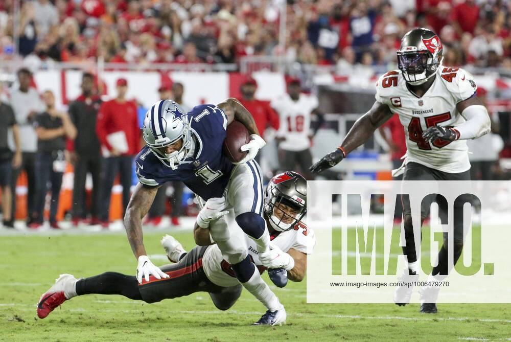 Tampa Bay Buccaneers safety Antoine Winfield Jr. (31) attempts to bring down Dallas Cowboys wide receiver Cedrick Wilson (1) as Buccaneers linebacker Devin White (45) watches the play during the first half of the Buccaneers home opening game Thursday, Sept. 9, 2021 in Tampa. Tampa USA - ZUMAs70_ 0133952540st
