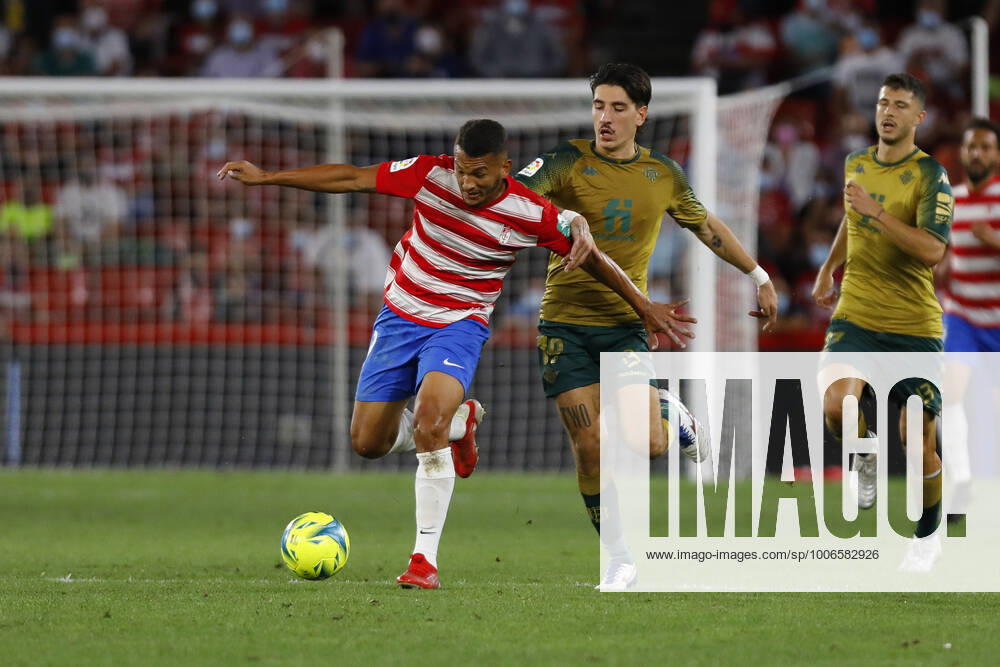 Granada CF v Real Betis - La Liga Santander Luis Javier Suarez, of Granada CF and Bellerin, of Real Betisduring the La Liga match between Granada CF and Real Betis at Nuevo Los Carmenes Stadium on September 13, 2021 in Granada, Spain. Granada Granada Spain camaramartinez-granadac210913_npjWr