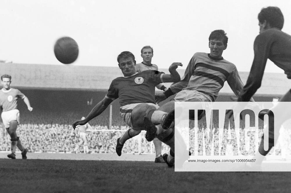 Football - 1963 1964 First Division - Liverpool 1 West Ham United 2 Liverpool s Roger Hunt and West Ham s Martin Peters and Jim Standen clash at Anfield with Bobby Moore in the background. It was to be 52 years before West Ham won at Liverpool again.