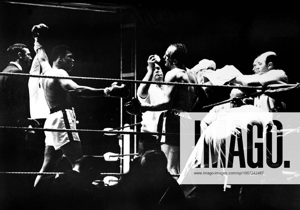 Muhammad Ali is declared the victor after a bloody heavyweight battle with Henry Cooper in London, England., Muhammad Ali, Henry Cooper Wembley Stadium, London, UK, Ref:VM SPO Muhammad Ali Henry Cooper.jpg, Muhammad Ali, Henry Cooper, boxing, heavyweight, knockout, blood, Wembley Stadium, London, UK