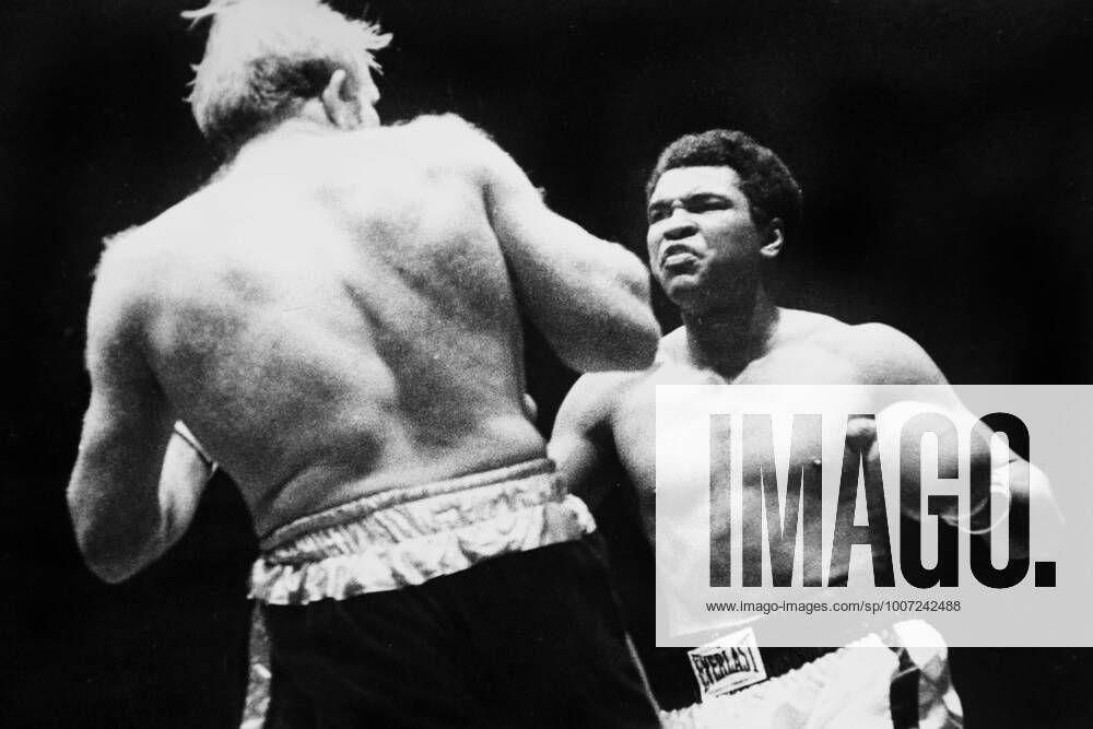 Muhammad Ali is declared the victor after a bloody heavyweight battle with Henry Cooper in London, England., Muhammad Ali, Henry Cooper Wembley Stadium, London, UK, Ref:VM SPO Muhammad Ali Richard Dunn 1.jpg, Muhammad Ali, Henry Cooper, boxing, heavyweight, knockout, blood, Wembley Stadium, London, UK