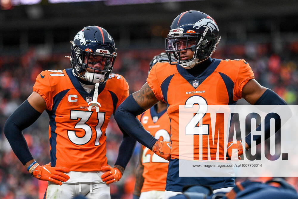 DENVER, CO - OCTOBER 31: Denver Broncos cornerback Pat Surtain II (2) and free safety Justin Simmons (31) look on as an injured player is tended to during a game between the Denver Broncos and the Washington Football Team at Empower Field at Mile High on October 31, 2021 in Denver, Colorado. (Photo by Dustin Bradford Icon Sportswire) NFL, American Football Herren, USA OCT 31 Washington Football Team at Broncos Icon132211031216