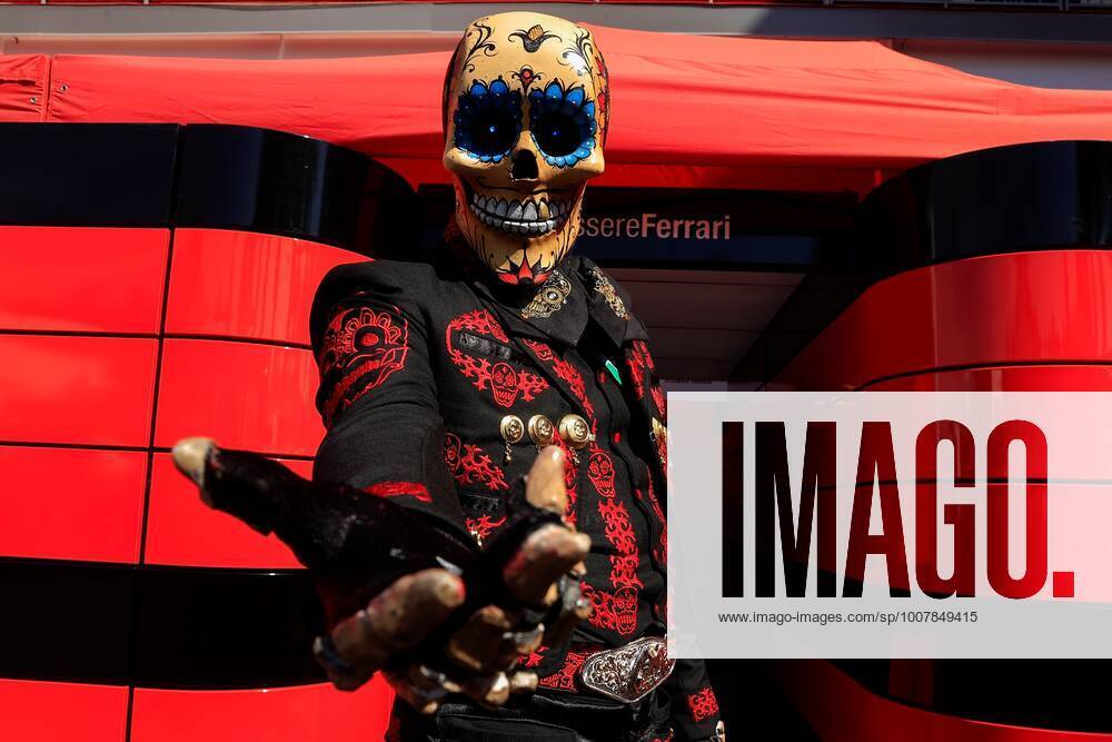 A person in a mariachi costume and a Catrina mask, alluding to the Day of the Dead, poses in front of the Ferrari shield before the start of the third practice for the Formula One Grand Prix of Mexico, that takes place at the Hermanos Rodriguez Autodrome, in Mexico City, Mexico, 06 November 2021. Formula One Grand Prix of Mexico !ACHTUNG: NUR REDAKTIONELLE NUTZUNG!