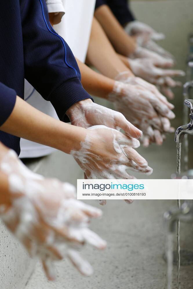 Reopening of school after coronavirus closure Junior high school students wash their hands at their school in Kuwana in Mie Prefecture, central Japan, on May 18, 2020, as part of infection control procedures. The school reopened the same day after a coronavirus pandemic state of emergency was lifted in the prefecture amid signs of improvement in the situation.