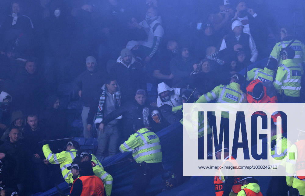 Leicester, England, 25th November 2021. Police draw their batons to keep the Legia Warsaw fans back during the UEFA Europa League match at the King Power Stadium, Leicester. Picture credit should read: Darren Staples Sportimage . SPI-1341-0063