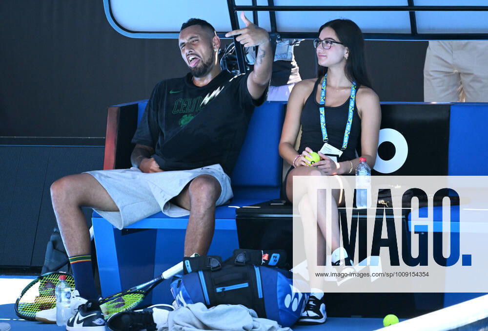 TENNIS AUSTRALIAN OPEN PRACTICE, Nick Kyrgios of Australia reacts to photographers while sitting with girlfriend Costeen Hatzi during a practice session ahead of the Australian Open, at Melbourne Park in Melbourne, Sunday, January 16, 2022. ( NO ARCHIVING, , NO USE IN BOOKS WITHOUT CONSENT MELBOURNE VIC AUSTRALIA