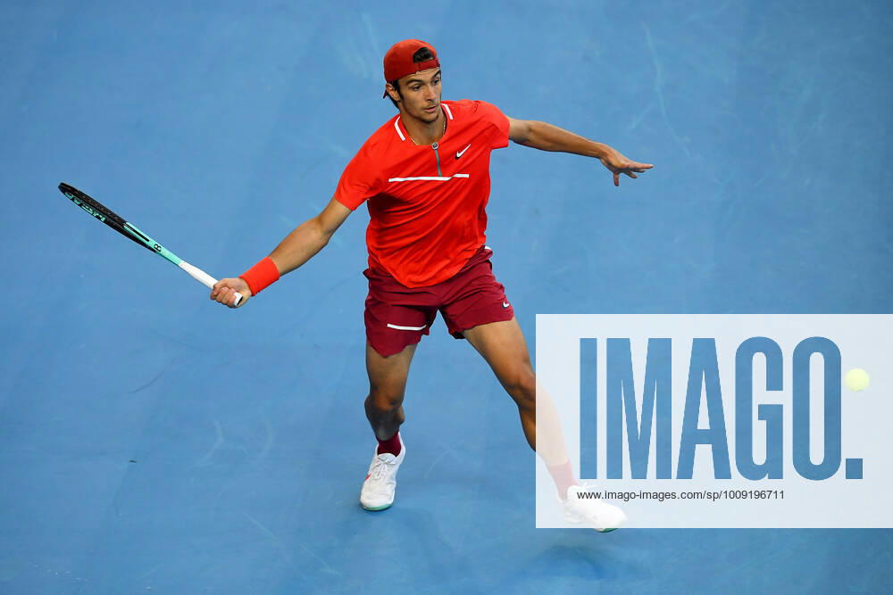 TENNIS AUSTRALIAN OPEN, Lorenzo Musetti of Italy plays a shot during his first round singles match against Alex de Minaur of Australia on Day 2 of the Australian Open, at Melbourne Park, in Melbourne, Tuesday, January 18, 2022. ( NO ARCHIVING, , NO USE IN BOOKS WITHOUT CONSENT MELBOURNE VIC AUSTRALIA