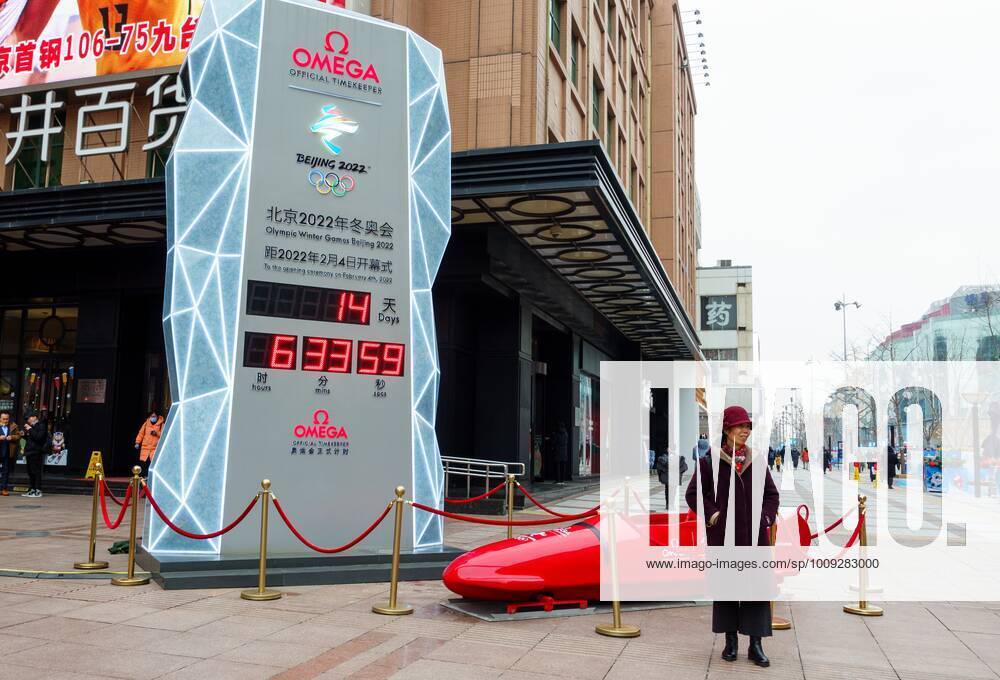 China Olympics 2022 Preparations 6746088 21.01.2022 A woman poses near a clock counting down the days to the beginning of the 2022 Winter Olympics, in Beijing, China. Anna Ratkoglo Sputnik Beijing China