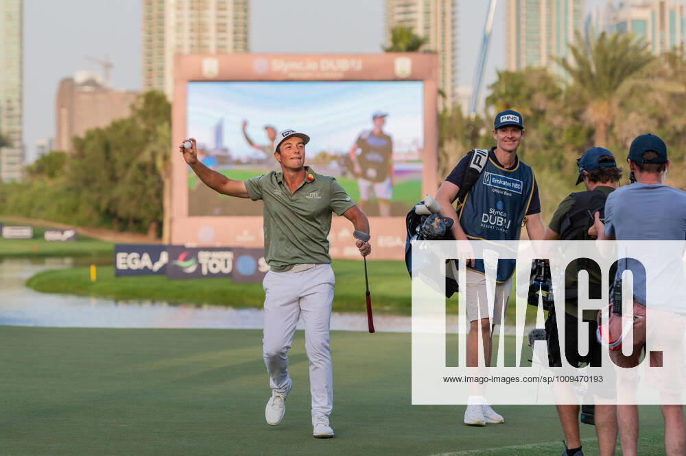 KW04 Viktor Holland of Norway throws his ball to the crowd after victory in the play off to win the 2022 DP World Tour Slync.io Dubai Desert Classic at Emirates Golf Club, Dubai, UAE on 30 January 2022.