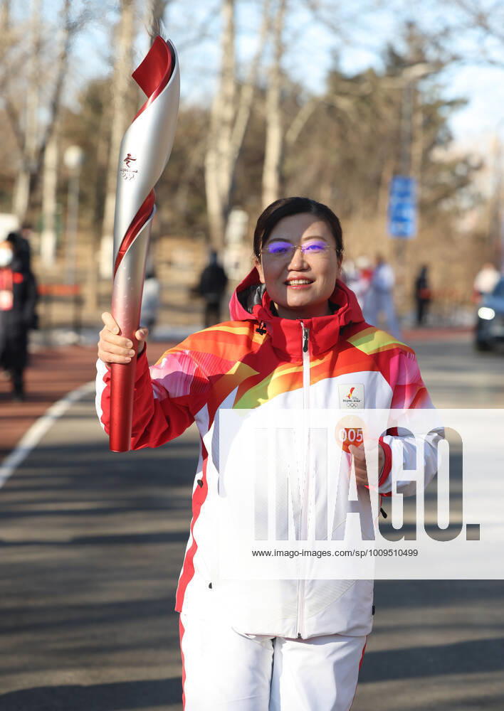 (220202) -- BEIJING, Feb. 2, 2022 -- Torch bearer Zhang Runqiu runs with the torch during the Beijing 2022 Olympic Torch Relay at the Olympic Forest Park in Beijing, capital of China, Feb. 2, 2022. ) (BEIJING 2022) CHINA-BEIJING-OLYMPIC TORCH RELAY (CN) JiaxHaocheng