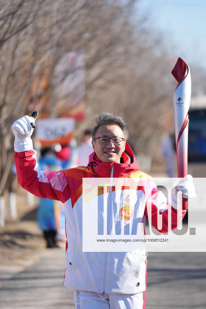(220202) -- BEIJING, Feb. 2, 2022 -- Torch bearer Qing Lijun runs with the torch during the Beijing 2022 Olympic Torch Relay at the Winter Olympic Park in Beijing, capital of China, Feb. 2, 2022. ) (BEIJING 2022) CHINA-BEIJING-OLYMPIC TORCH RELAY (CN) XingxGuangli