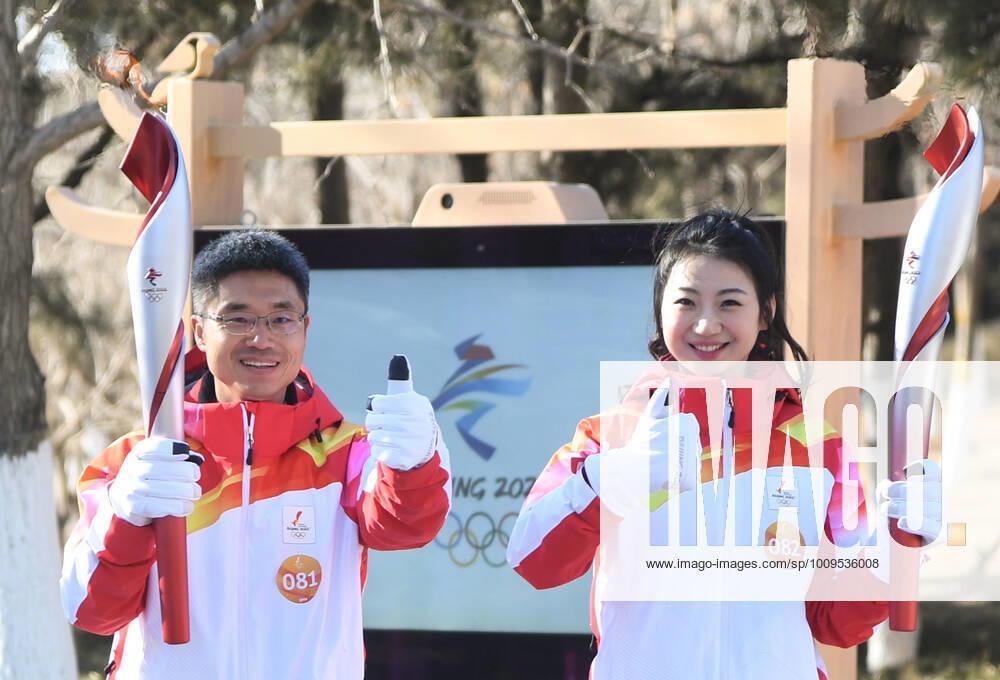 (220204) -- BEIJING, Feb. 4, 2022 -- Torch bearers Wu Yadong (L) and Wang Xi attend the Beijing 2022 Olympic Torch Relay at the Grand Canal Forest Park in Beijing, capital of China, Feb. 4, 2022. ) (BEIJING2022)CHINA-BEIJING-OLYMPIC TORCH RELAY (CN) RenxChao