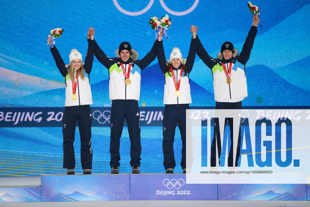 OLYMPICS - Winter Olympic Games, Olympische Spiele, Olympia, OS Beijing 2022 ZHANGJIAKOU,CHINA,08.FEB.22 - OLYMPICS, NORDIC SKIING, Ski jumping, Skispringen, Ski, nordisch - Winter Olympic Games Beijing 2022, normal hill, mixed team event, award ceremony. Image shows the rejoicing of Nika Kriznar, Timi Zajc, Ursa Bogataj and Peter Prevc (SLO). keywords: medal. GEPAxpictures Klansek