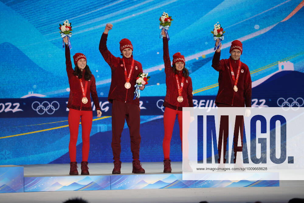 OLYMPICS - Winter Olympic Games, Olympische Spiele, Olympia, OS Beijing 2022 ZHANGJIAKOU,CHINA,08.FEB.22 - OLYMPICS, NORDIC SKIING, Ski jumping, Skispringen, Ski, nordisch - Winter Olympic Games Beijing 2022, normal hill, mixed team event, award ceremony. Image shows the rejoicing of Alexandria Loutitt, Matthew Soukup, Abigail Strate and Mackenzie Boyd-Clowes (CAN). keywords: medal. GEPAxpictures Klansek