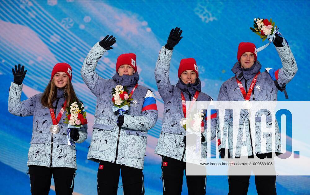 China Olympics 2022 Medal Ceremony 8108137 08.02.2022 Silver medalists Russian Olympic Committee s Irma Makhinia, Danil Sadreev, Irina Avvakumova, Evgeniy Klimov celebrates on the podium during the medal ceremony for the Ski jumping, Skispringen, Ski, nordisch mixed team event of the Beijing 2022 Winter Olympic Games, Olympische Spiele, Olympia, OS at the Medals Plaza in Zhangjiakou, China. Ramil Sitdikov Sputnik Beijing China