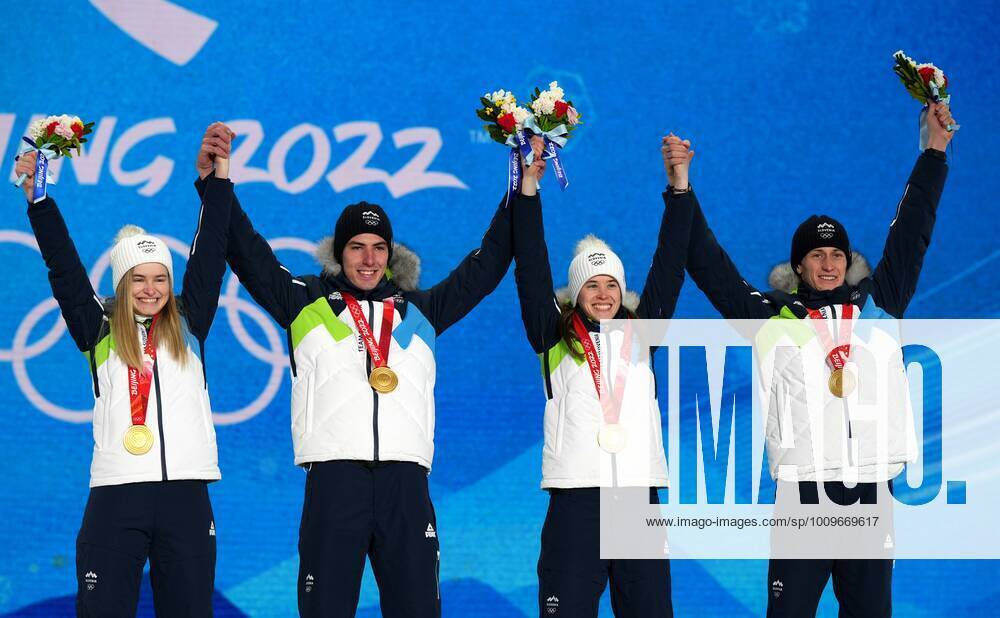 China Olympics 2022 Medal Ceremony 8108145 08.02.2022 Gold medalists Slovenia s Nika Kriznar, Timi Zajc, Ursa Bogataj and Peter Prevc celebrates on the podium during the medal ceremony for the Ski jumping, Skispringen, Ski, nordisch men s normal hill individual event of the Beijing 2022 Winter Olympic Games, Olympische Spiele, Olympia, OS at the Medals Plaza in Zhangjiakou, China. Ramil Sitdikov Sputnik Beijing China