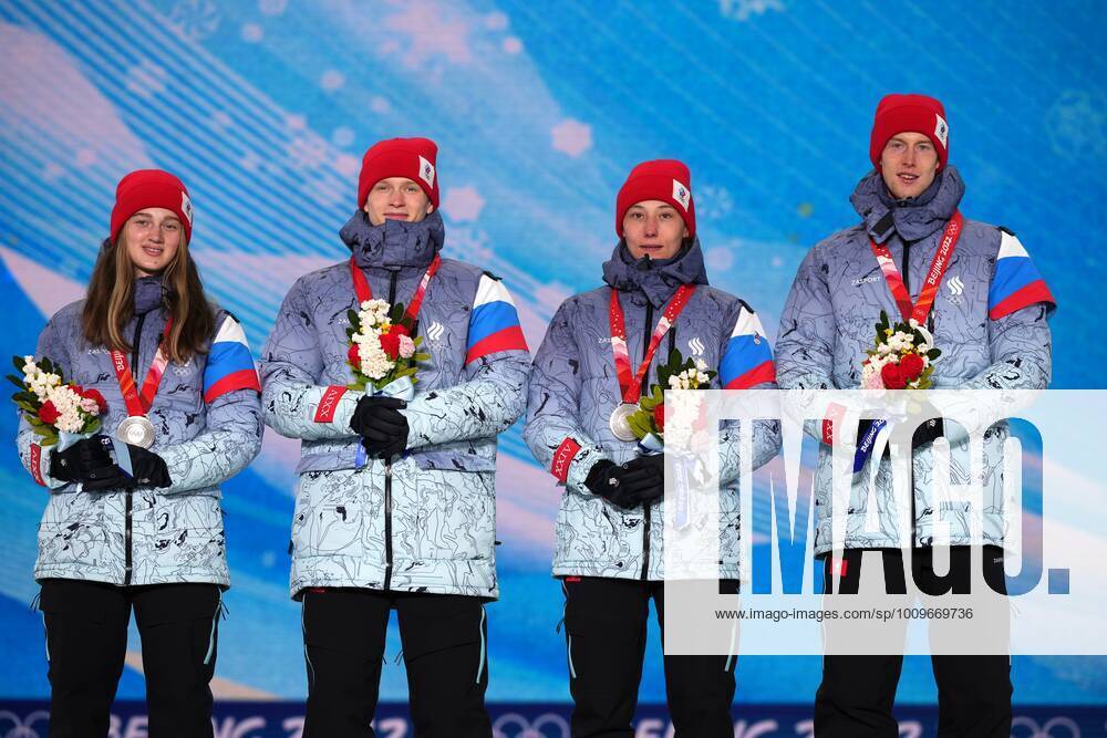 China Olympics 2022 Medal Ceremony 8108189 08.02.2022 Silver medalists Russian Olympic Committee s Irma Makhinia, Danil Sadreev, Irina Avvakumova, Evgeniy Klimov pose on the podium during the medal ceremony for the Ski jumping, Skispringen, Ski, nordisch mixed team event of the Beijing 2022 Winter Olympic Games, Olympische Spiele, Olympia, OS at the Medals Plaza in Zhangjiakou, China. Ramil Sitdikov Sputnik Beijing China