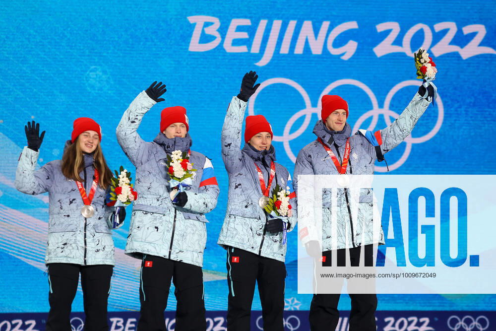 Silver medallists Irma Makhinya, Danil Sadreyev, Irina Avvakumova and Yevgeny Klimov of Team ROC (L-R) wave during the victory ceremony for the mixed team normal hill (NH) final at the Medal Plaza at the 2022 Winter Olympic Games, Olympische Spiele, Olympia, OS Russian Olympic Committee TASS THIS IMAGE WAS PROVIDED BY A THIRD PARTY. TS121F79