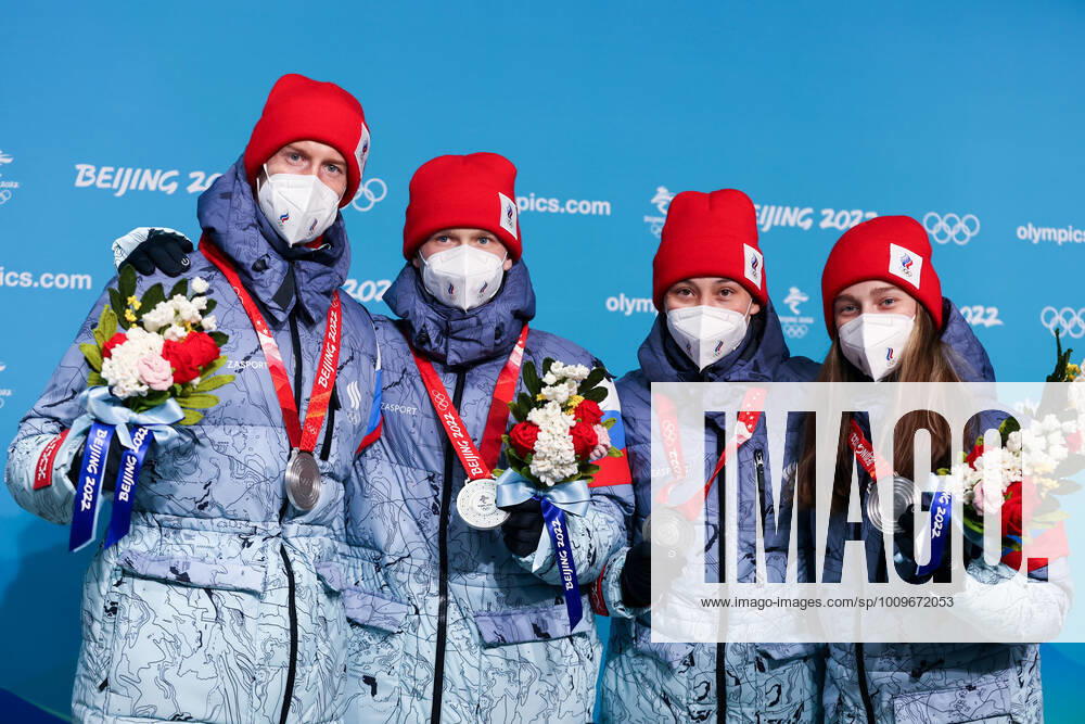 Silver medallists Irma Makhinya, Danil Sadreyev, Irina Avvakumova and Yevgeny Klimov of Team ROC (L-R) show their medals during the victory ceremony for the mixed team normal hill (NH) final at the Medal Plaza at the 2022 Winter Olympic Games, Olympische Spiele, Olympia, OS Russian Olympic Committee TASS THIS IMAGE WAS PROVIDED BY A THIRD PARTY. TS121F7A