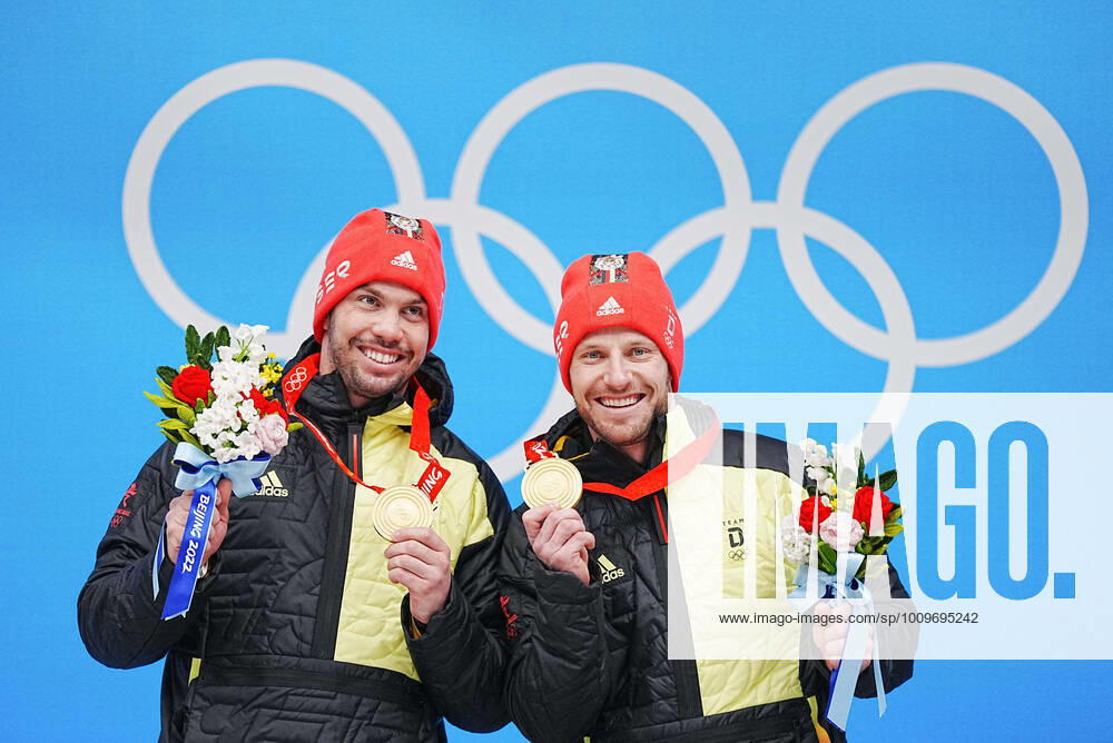 (220209) -- BEIJING, Feb. 9, 2022 -- Gold medalists Tobias Wendl Tobias Arlt of Germany celebrate during the awarding ceremony of luge doubles run at the Yanqing National Sliding Centre in Yanqing district of Beijing, capital of China, Feb. 9, 2022. ) (BEIJING2022)CHINA-BEIJING-YANQING-OLYMPIC Winter games, Winterspiele,Spiele, Summer games LUGE-DOUBLES (CN) JiangxWenyao