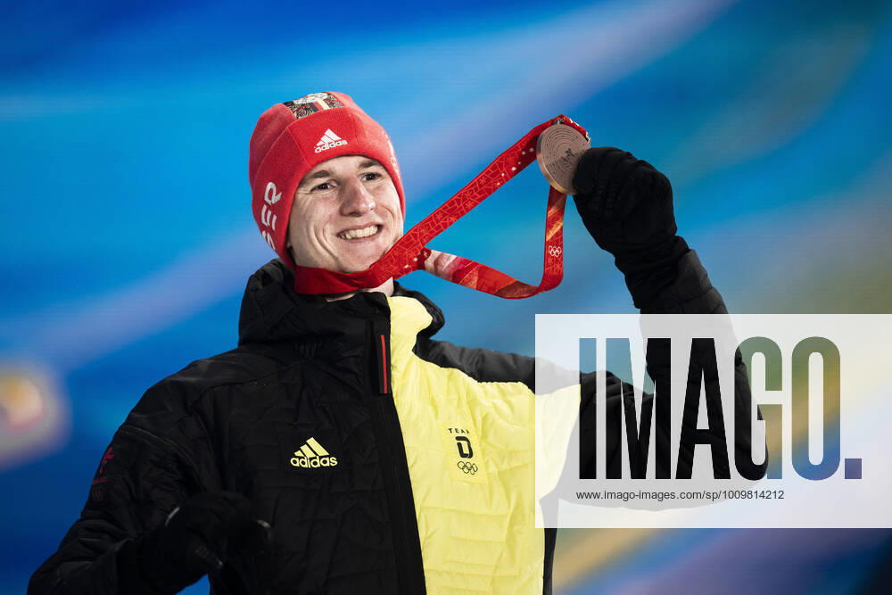 Karl Geiger of Germany celebrates with his bronze medal at the medal ceremony for men s ski jumping large hill individual during day 9 of the 2022 Winter Olympics on February 13, 2022 in Zhangjiakou Photo Jon Olav Nesvold BILDBYRAN COP 217 JE0041 olympic games olympics winter olympics os ol olympics winter os os olympics peking peking peking 2022 beijing 2022 beijing 2022 olympic games beijing 2022 winter olympic games peking os beijing ol winter ol 9 bbeng norway jubilant gold,
