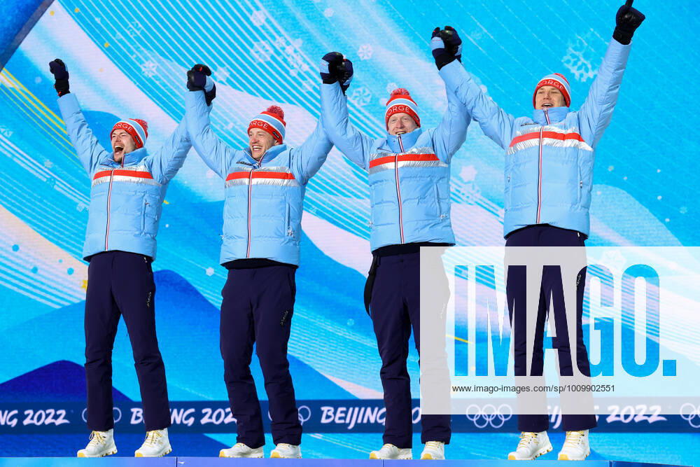 BEIJING 2022, Biathlon, 4x7,5km Staffel Männer, Siegerehrung ZHANGJIAKOU, CHINA - FEBRUARY 16, 2022: Athletes Sturla Holm Laegreid, Tarjei Bo, Johannes Bo and Vetle Sjastad Christiansen (L-R) of Norway celebrate their gold medals during the men s biathlon relay victory ceremony at the Medal Plaza as part of the 2022 Winter Olympic Games, Olympische Spiele, Olympia, OS Stanislav Krasilnikov TASS TS123933