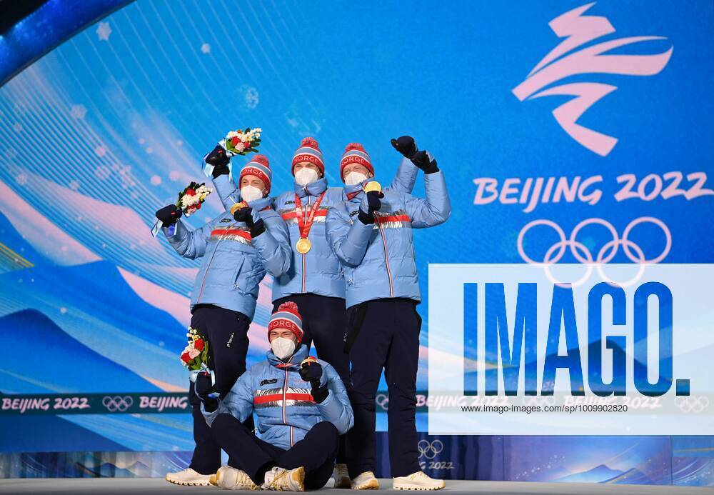 BEIJING 2022, Biathlon, 4x7,5km Staffel M?nner, Siegerehrung China Olympics 2022 Medal Ceremony 8117019 16.02.2022 Gold medalists Norway s Sturla Holm Laegreid, Tarjei Boe, Johannes Thingnes Boe and Vetle Sjaastad Christiansen celebrate during an award ceremony for the biathlon men s 4x7.5 km relay event during the Beijing 2022 Winter Olympic Games, Olympische Spiele, Olympia, OS at the Medals Plaza in Zhangjiakou, China. Alexey Filippov Sputnik Beijing China