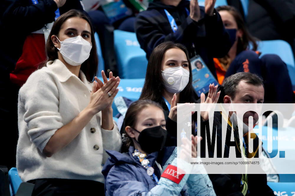 Russian rhythmic gymnast Margarita Mamun, figure skaters Anna Shcherbakova and Alina Zagitova (L-R) watch the pairs free skating event at the 2022 Winter Olympic Games, Olympische Spiele, Olympia, OS at the Capital Indoor Stadium. Valery Sharifulin TASS TS124543