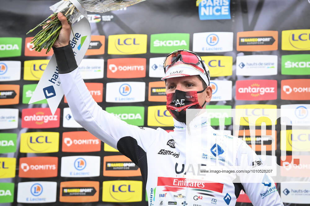 Portuguese Joao Almeida of UAE Team Emirates celebrates on the podium in the white jersey for best young rider after stage seven of the 80th edition of the Paris-Nice cycling race, from Nice to La Bollene-Vesubie (Col de Turini) (155,2 km) in France, Saturday 12 March 2022. DAVIDxSTOCKMAN x20943085x
