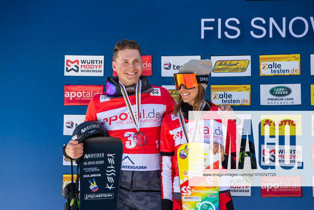 SNOWBOARDING - FIS WC Berchtesgaden BERCHTESGADEN,GERMANY,20.MAR.22 - SNOWBOARDING - FIS World Cup, mixed team event, ladies, men. Image shows Arvid Auner (AUT) and Julia Dujmovits (AUT). GEPAxpictures xGintarexKarpaviciute