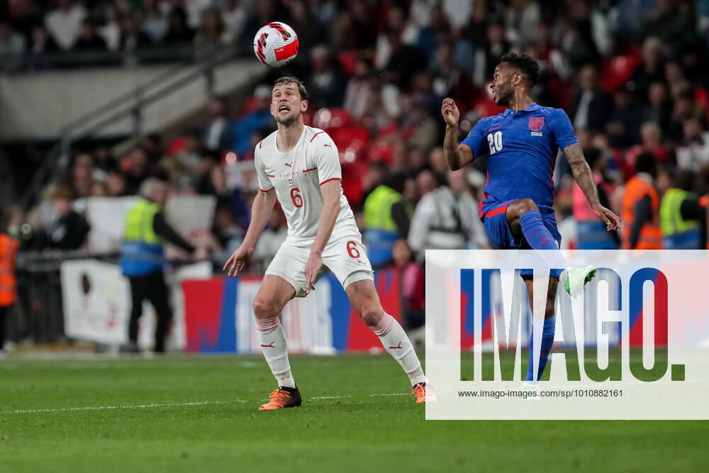 LONDON, ENGLAND MARCH 26 during the international friendly match between England and Switzerland at Wembley Stadium on March 26, 2022 in London, United Kingdom Fabian Frei of Switzerland against Raheem Sterling of England London Wembley Stadium England United Kingdom