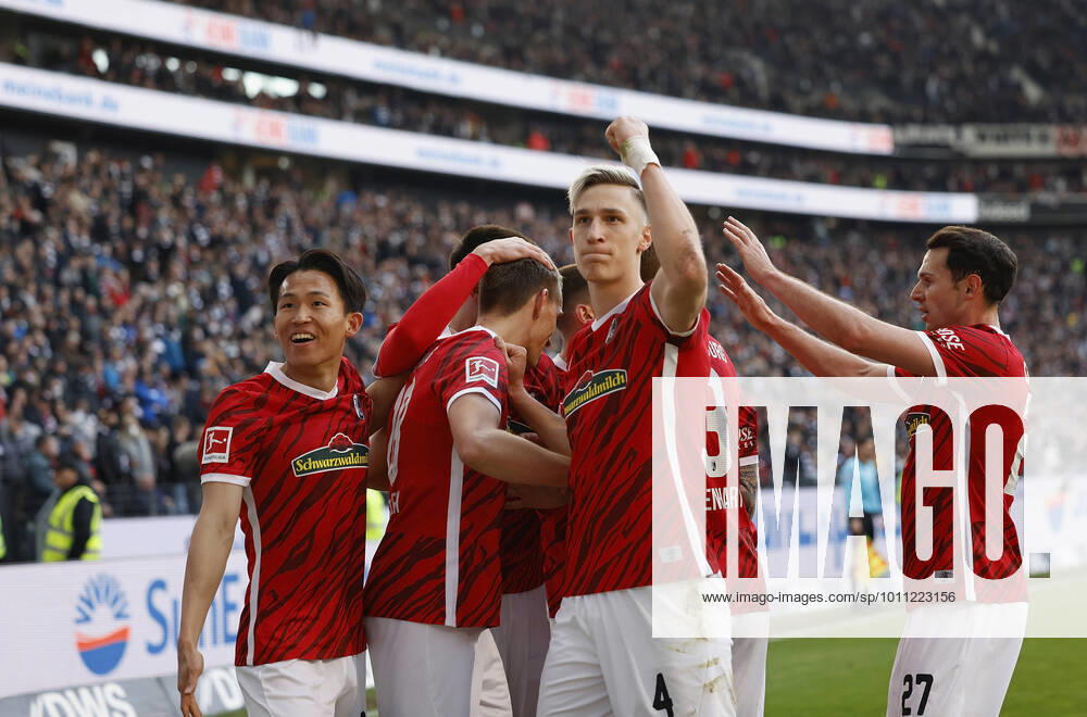 Football, Bundesliga, Matchday 29, Eintracht Frankfurt SC Freiburg, GER, Frankfurt am Main, Deutsche Bank Park Picture v li Woo yeong Jeong SC Freiburg , Goal scorer Nils Petersen SC Freiburg , Nico Schlotterbeck SC Freiburg and Lukas Kuebler SC Freiburg , cheering after the goal to 2 1, cheering, cheering, cheering, emotions DFL REGULATES PROHIBIT ANY USE OF PHOTOGRAPHS AS IMAGE SEQUENCES AND OR QUASI VIDEO