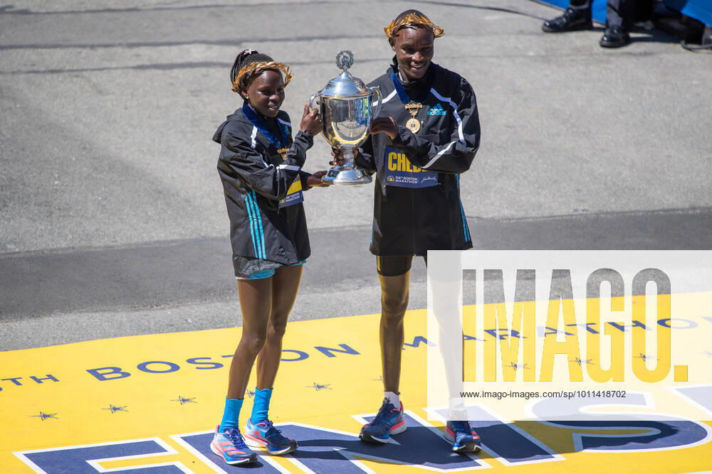 KW16 BOSTON, MA - APRIL 18: Peres Jepchirchir (left) of Kenya, the winner of the women s professional division of the Boston Marathon, and Evans Chebet (right) of Kenya, the winner of the men s professional division of the Boston Marathon, pose with the trophy on April 18, 2022 on Boylston Street in Boston, MA. Jepchirchir finished with a time of 2:21:01 and Chebet finished with a time of 2:06:51. (Photo by Erica Denhoff Icon Sportswire) MARATHON: APR 18 126th Boston Marathon Icon22041828