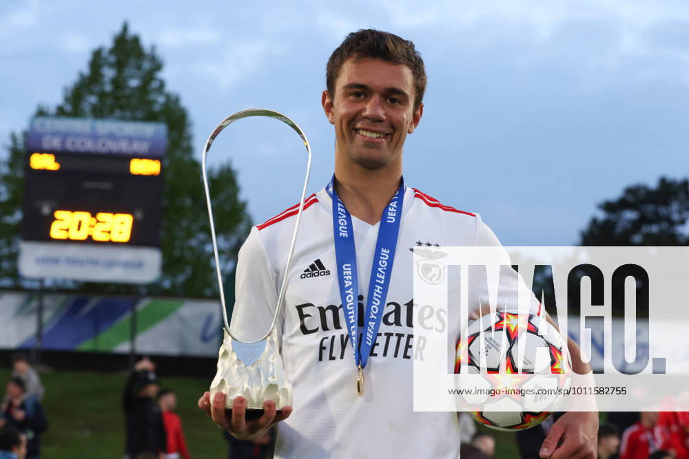 Nyon, Switzerland, 25th April 2022. Henrique Araujo of SL Benfica celebrates with his medal, the match ball and the trophy following his hat-trick in the 5-0 victory in the UEFA Youth League match at Colovray Sports Centre, Nyon. Picture credit should read: Jonathan Moscrop Sportimage . SPI-1659-0025