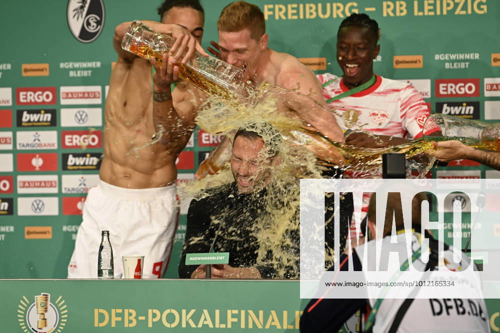Beer shower for coach coach Domenico Tedesco RasenBallsport Leipzig RBL during the press conference PK led by Yussuf Poulsen 09 RasenBallsport Leipzig RBL 79 DFB Cup Final SC Freiburg SCF vs RB Leipzig RBL Olympiastadion Berlin 21 05 2022 DFL REGULATIONS PROHIBIT ANY USE OF PHOTOGRAPHS AS IMAGE SEQUENCES AND OR QUASI VIDEO 79 DFB Cup Final SC Freiburg SCF vs RB Leipzig RBL