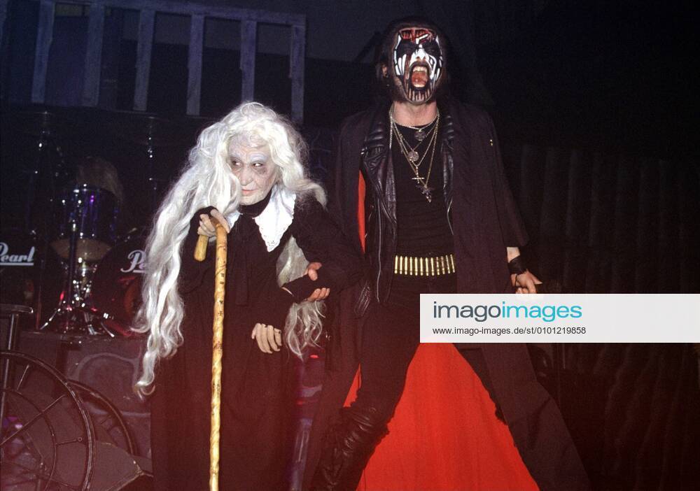 1 concert 90 King Diamond with old woman as victim, singer, heavy metal, hard rock, hard rock, mask, artificial blood, blood, stage show, horror, staging, brutal, brutality, music,